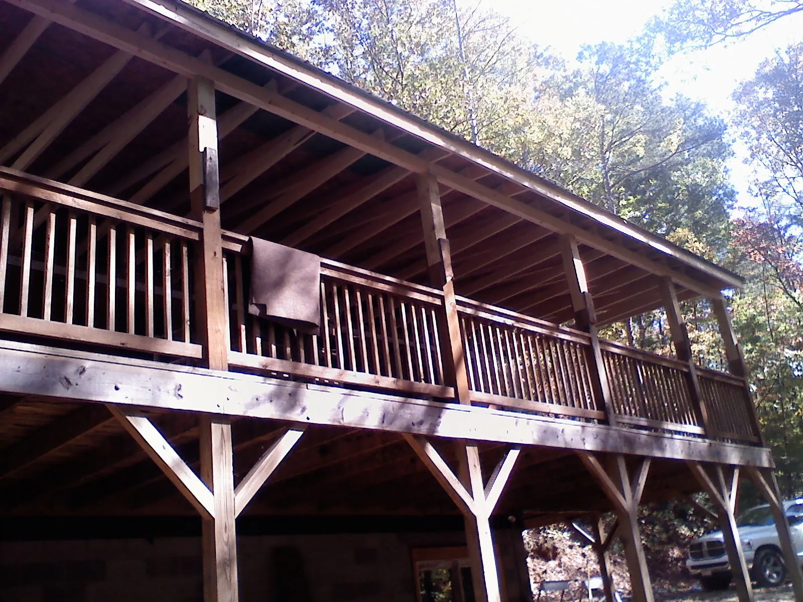 Timber framing under a new elevated porch and deck — Roof Leak Repair in Parsonsfield by Roofing Brothers